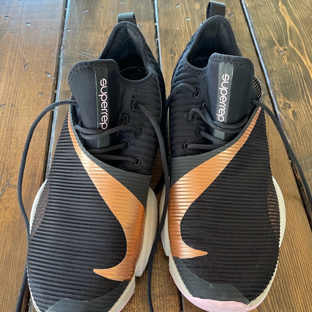 Nike Black Athletic Shoes with Copper Swoosh